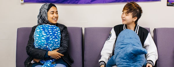 UC Riverside LGBTRC students hanging out on couch.