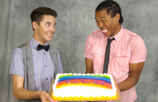 LGBTRC students holding Pride cake.