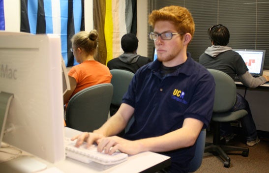 LGBTRC student working on computer in David Bohnett CyberCenter.